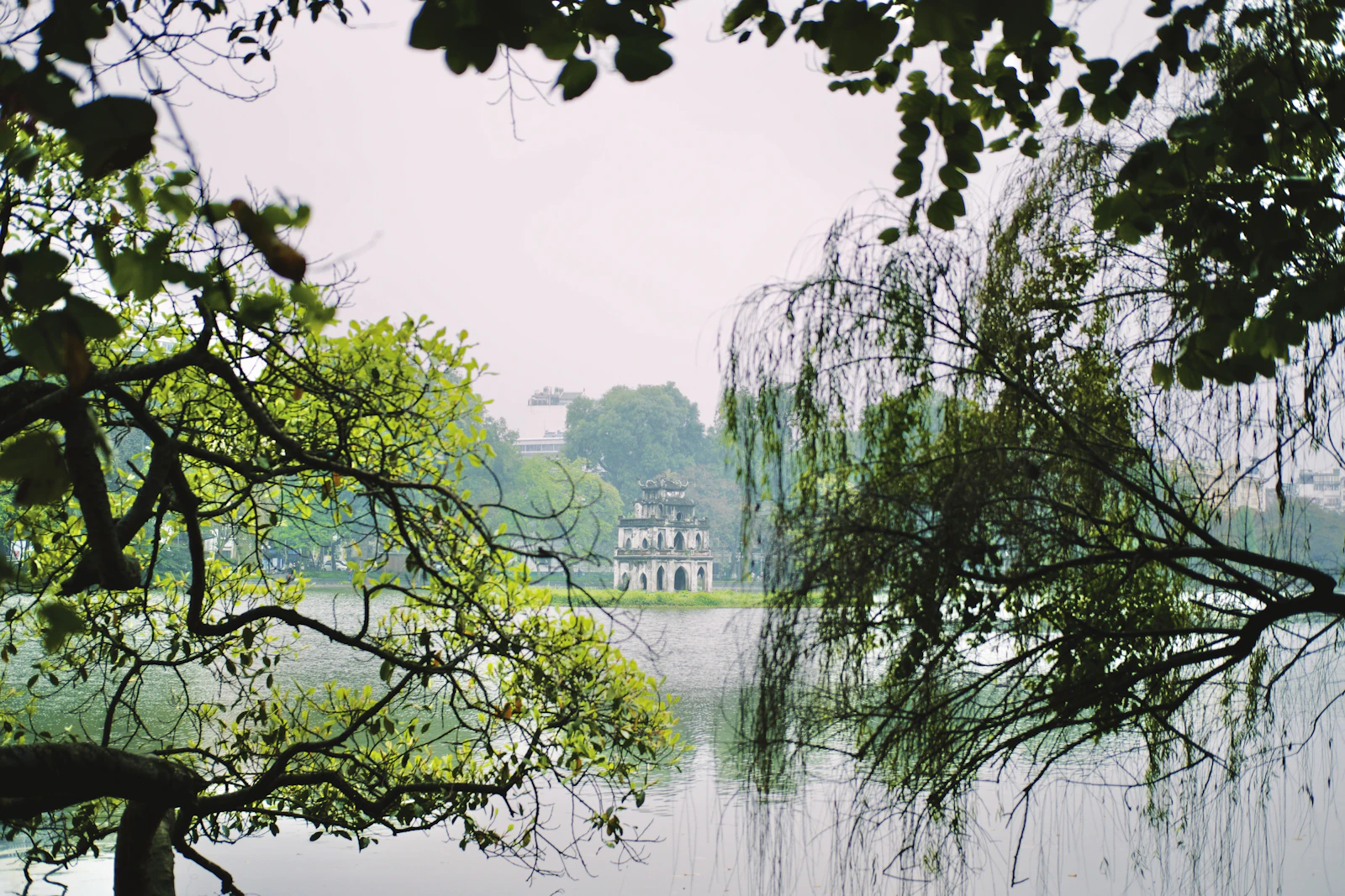 Hoan Kiem Lake area in Hanoi with green trees